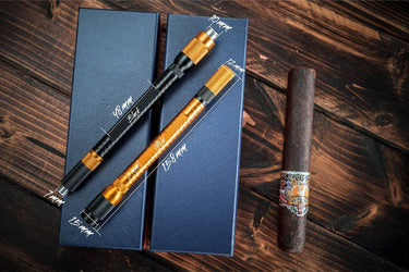 Black and gold 4-in-1 cigar draw tools on their gift boxes, with dimensions marked