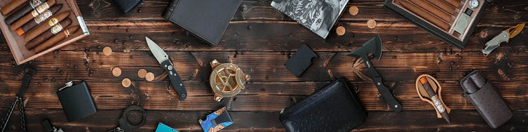 Collection of knives and tools on a wooden surface

