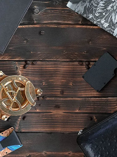 Collection of knives and tools on a wooden surface

