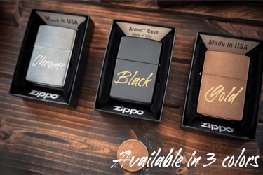 Chrome, black and gold Zippo lighters in their open Zippo boxes, labeled Chrome, Black and Gold