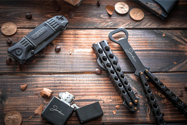 Black flip action bottle opener engraved with a name, next to a lighter engraved with the same name
