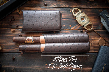 Brown 2-cigar travel case, cap removed, with two cigars resting in the lower shell
