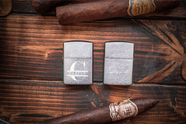 Chrome Zippo lighters engraved with a split monogram and name and with a short script line