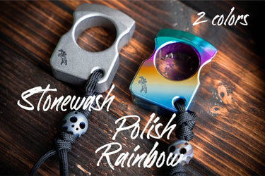 Titanium keychain in stone and rainbow finishes, each on a paracord lanyard